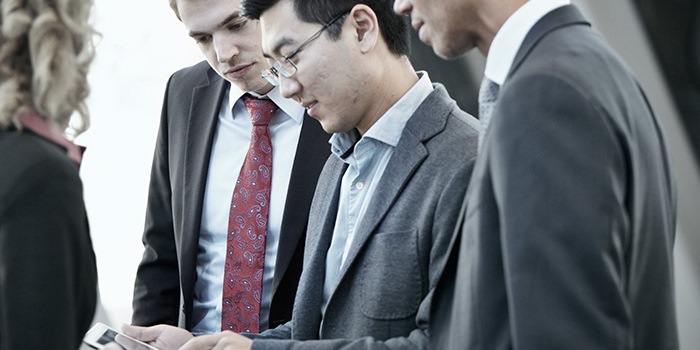 Business people looking at tablet